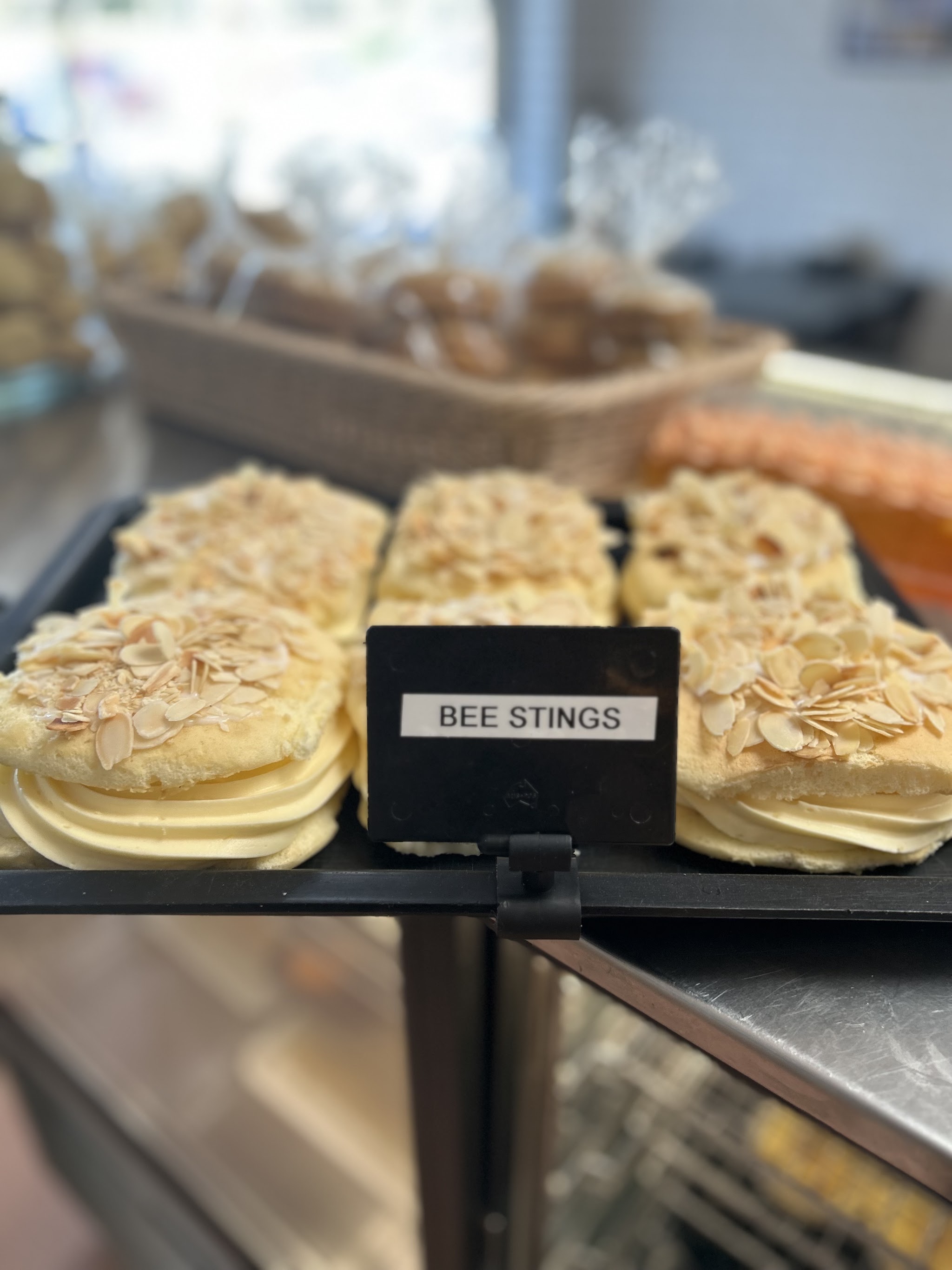 Bee Stings, almond topped buns, on a display tray